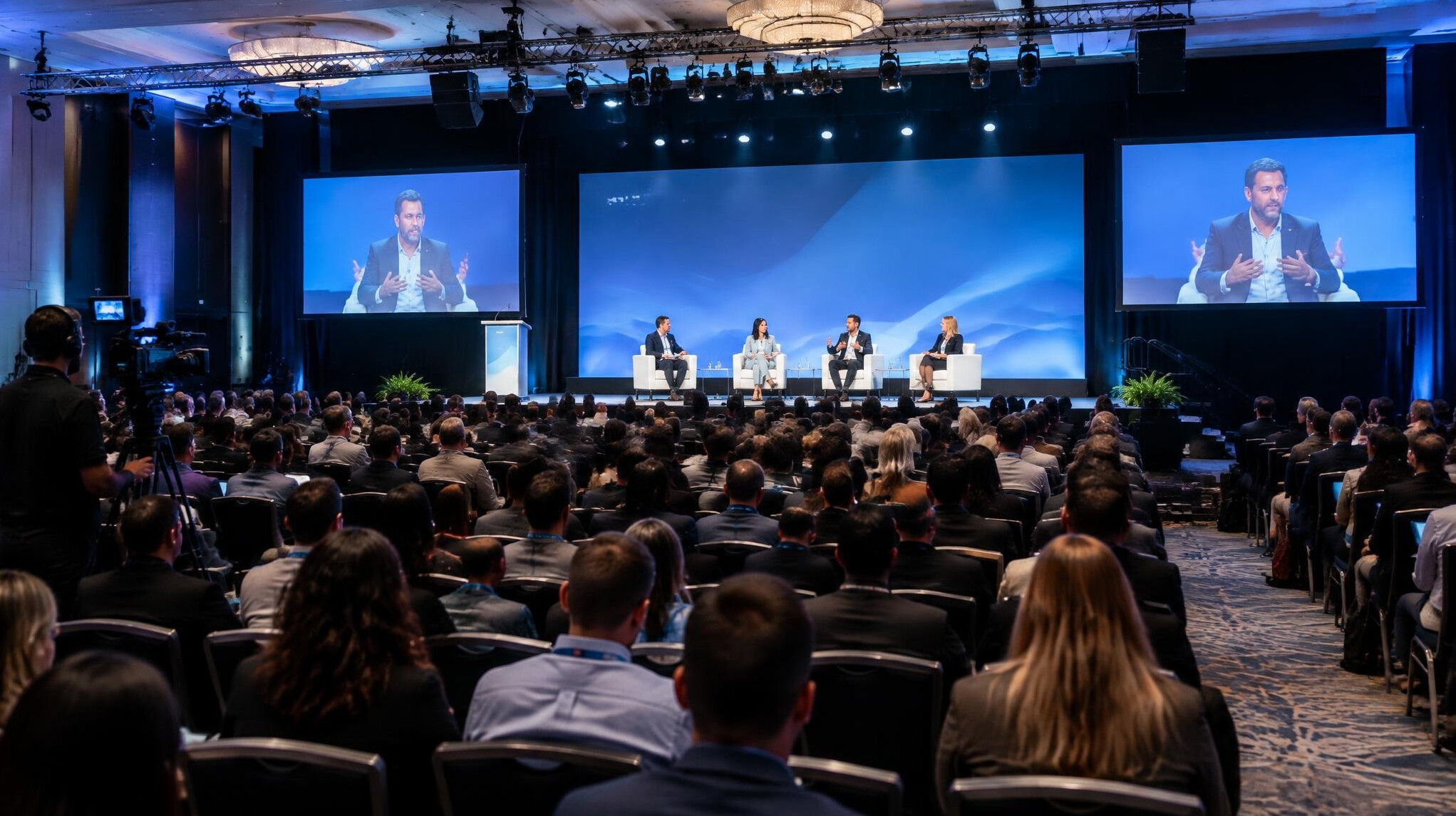 Conference hall with audience during live event coverage