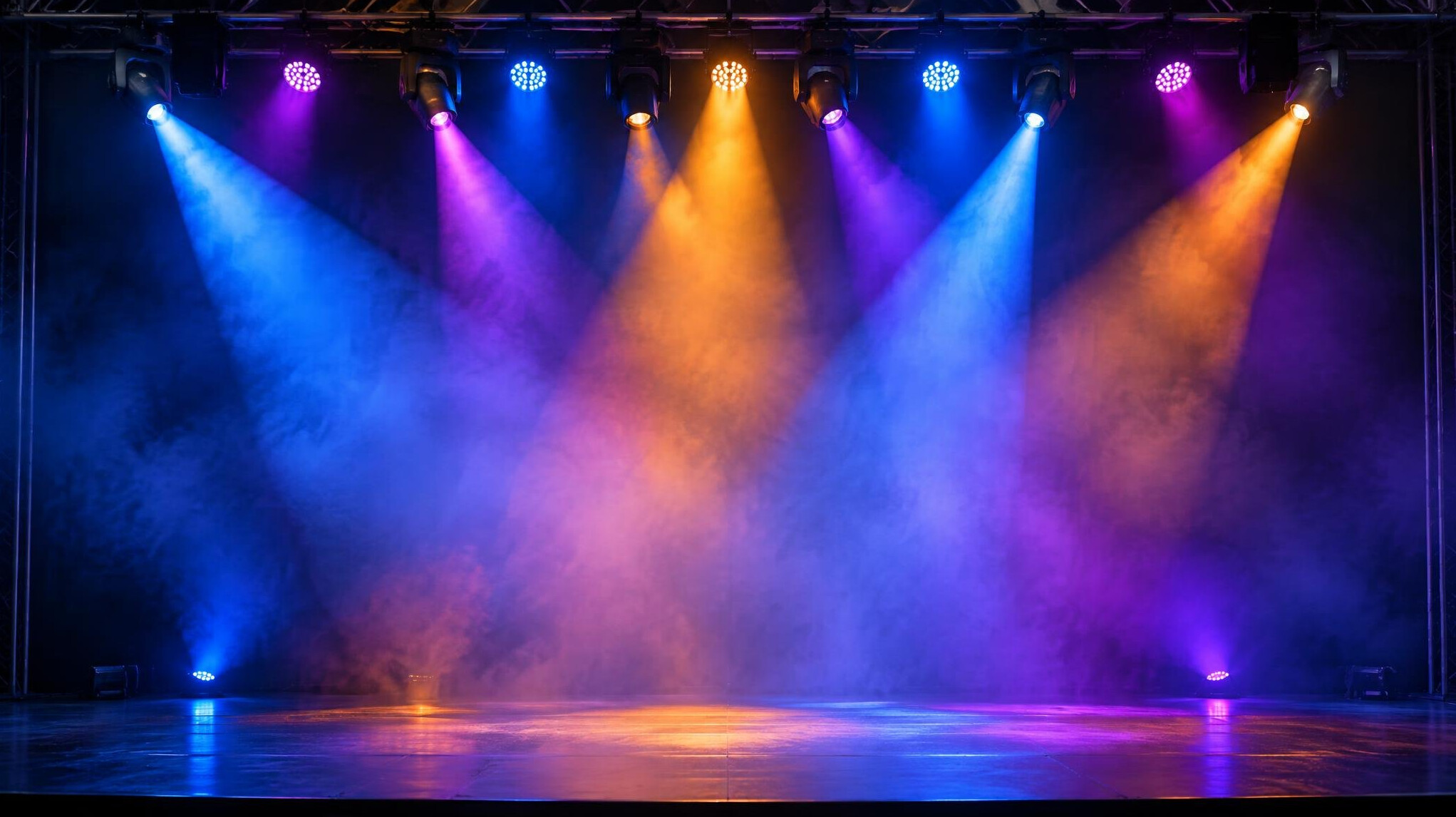 Stage lights with colored beams for lighting cues